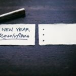 New year resolutions on a piece of paper with a pen.