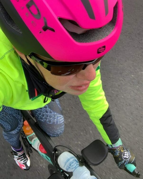 An athlete riding her bike as part of her 70.3 DIY Training Camp. 