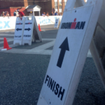 A sign with arrows pointing to the finish line.
