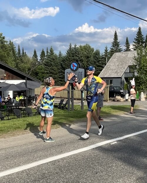 High fives on the Ironman Lake Placid Course.